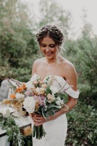 Bridal bouquet muted colors, peach, yellow, white, sage