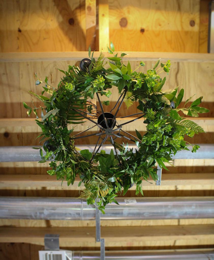 Sitting under floral chandelier