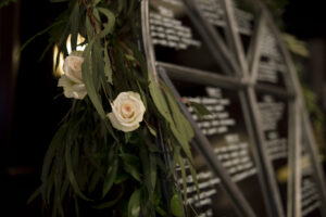 Seating chart decor wedding roses garland