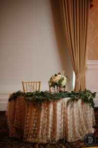 Sweetheart table decor wedding reception greenery garland